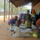 Somali mothers sit outside a feeding center with their malnourished children, Thursday, Sept. 28, 2000 in Dadaab refugee camp in northern Kenya. In 2000 Dadaab was home to 127,000 refugees, mainly Somalis; today that number is 245,000. Photo credit: Andrew England/AP